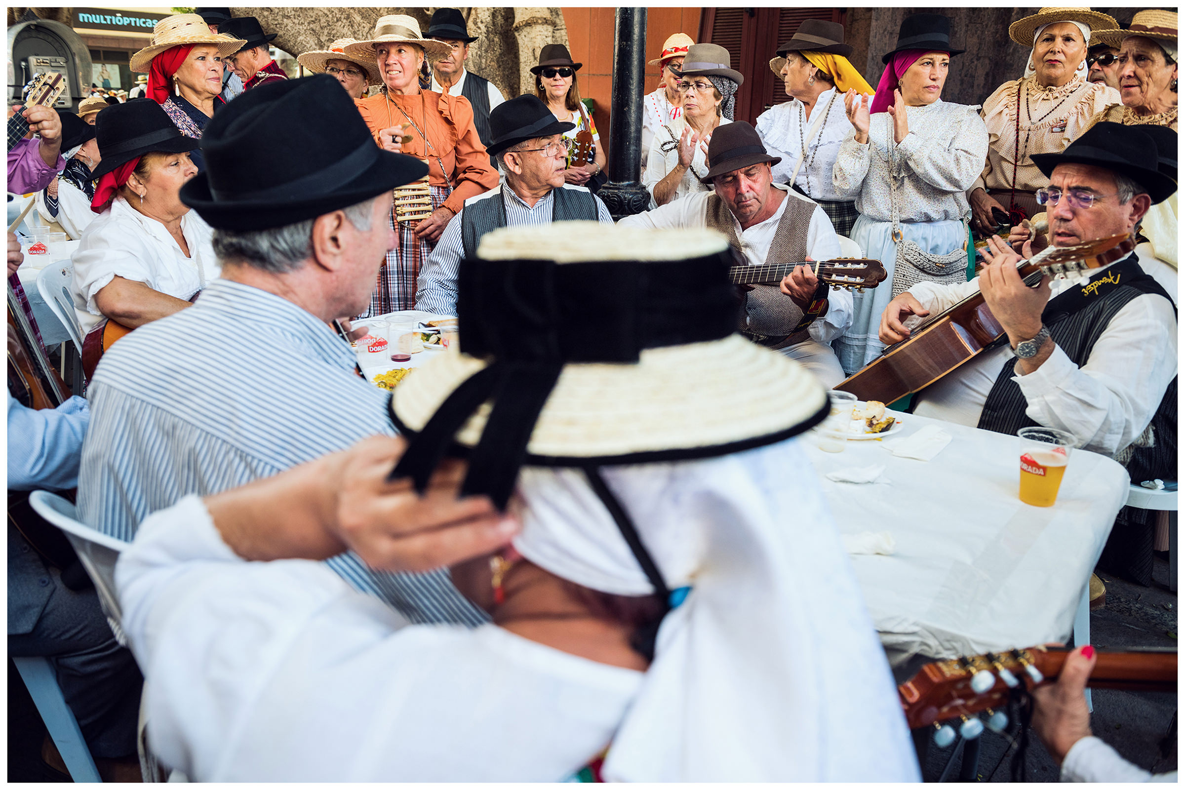 San Sebastian de la Gomera, La Gomera, Canary Islands, Spain. The inhabitants of the city of San Sebastian de la Gomera celebrate the city festival Romeria. Men, women and children play traditional Canarian musical instruments.