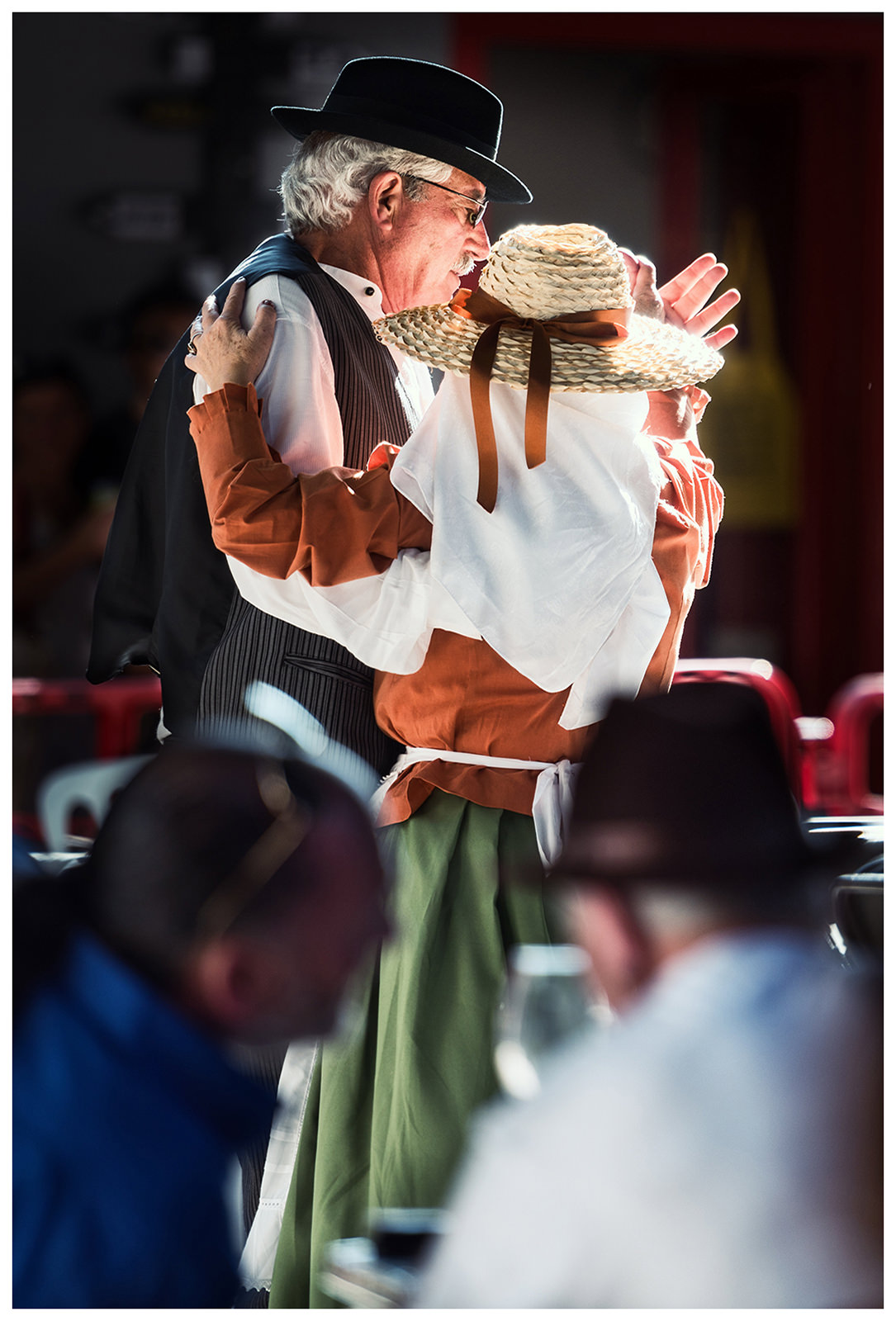 San Sebastian de la Gomera, La Gomera, Canary Islands, Spain. The inhabitants of the city San Sebastian de la Gomera celebrate the city festival Romeria. An older man dances with a woman.