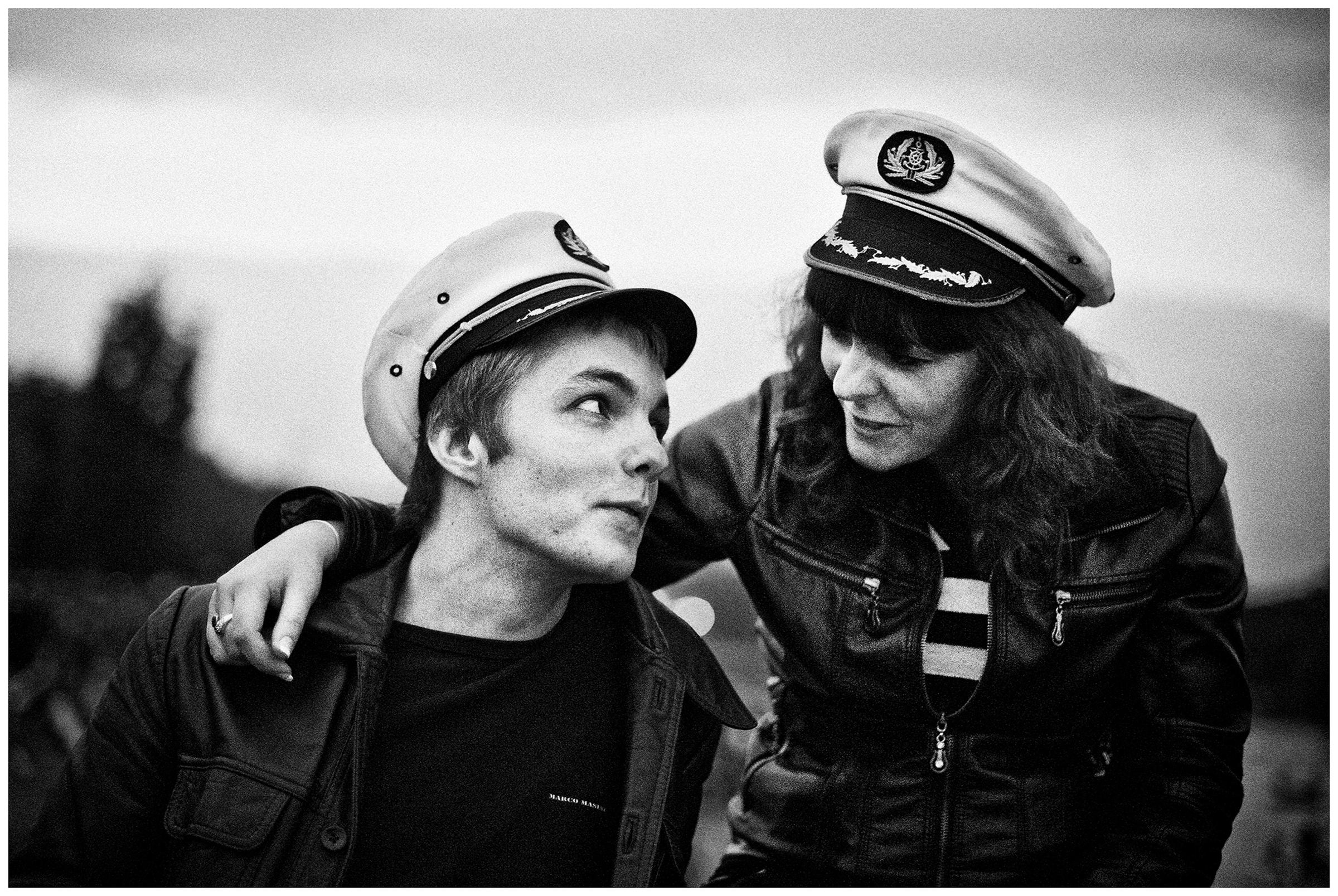 Kaliningrad, Russia. A man and a woman sitting on the street at night.