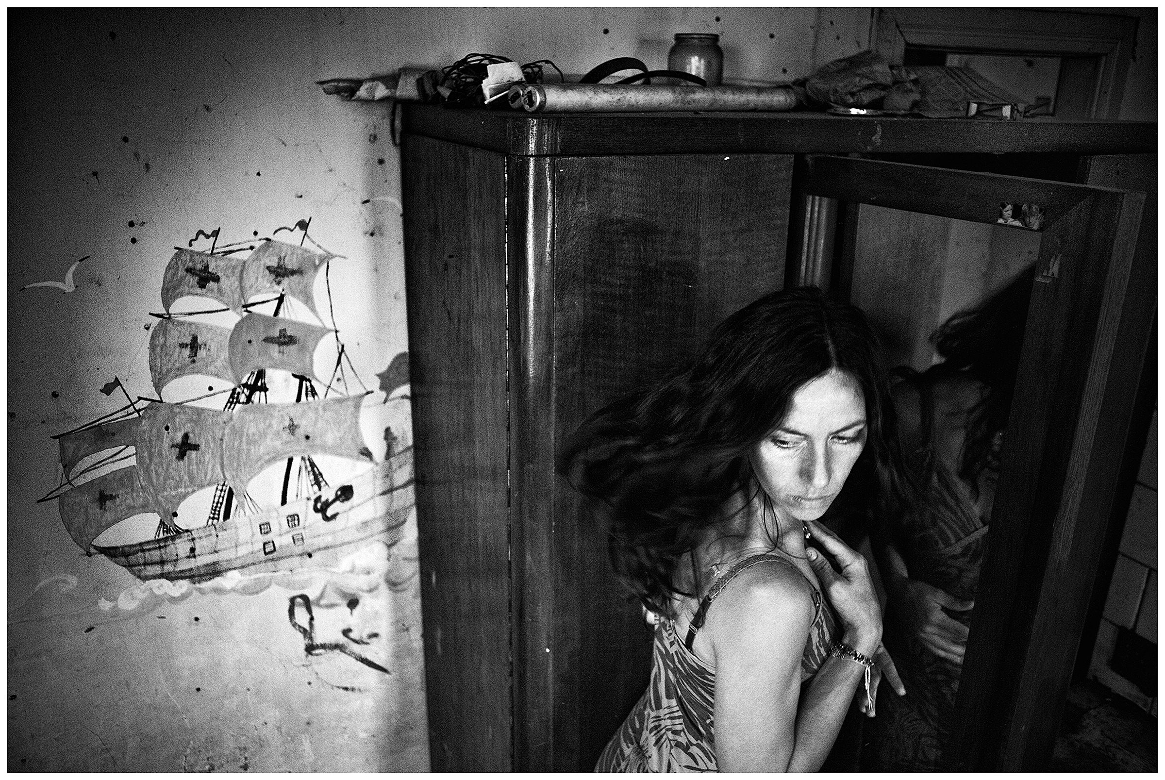 Kaliningrad, Russia. A woman is standing in front of a cupboard with a mirror.