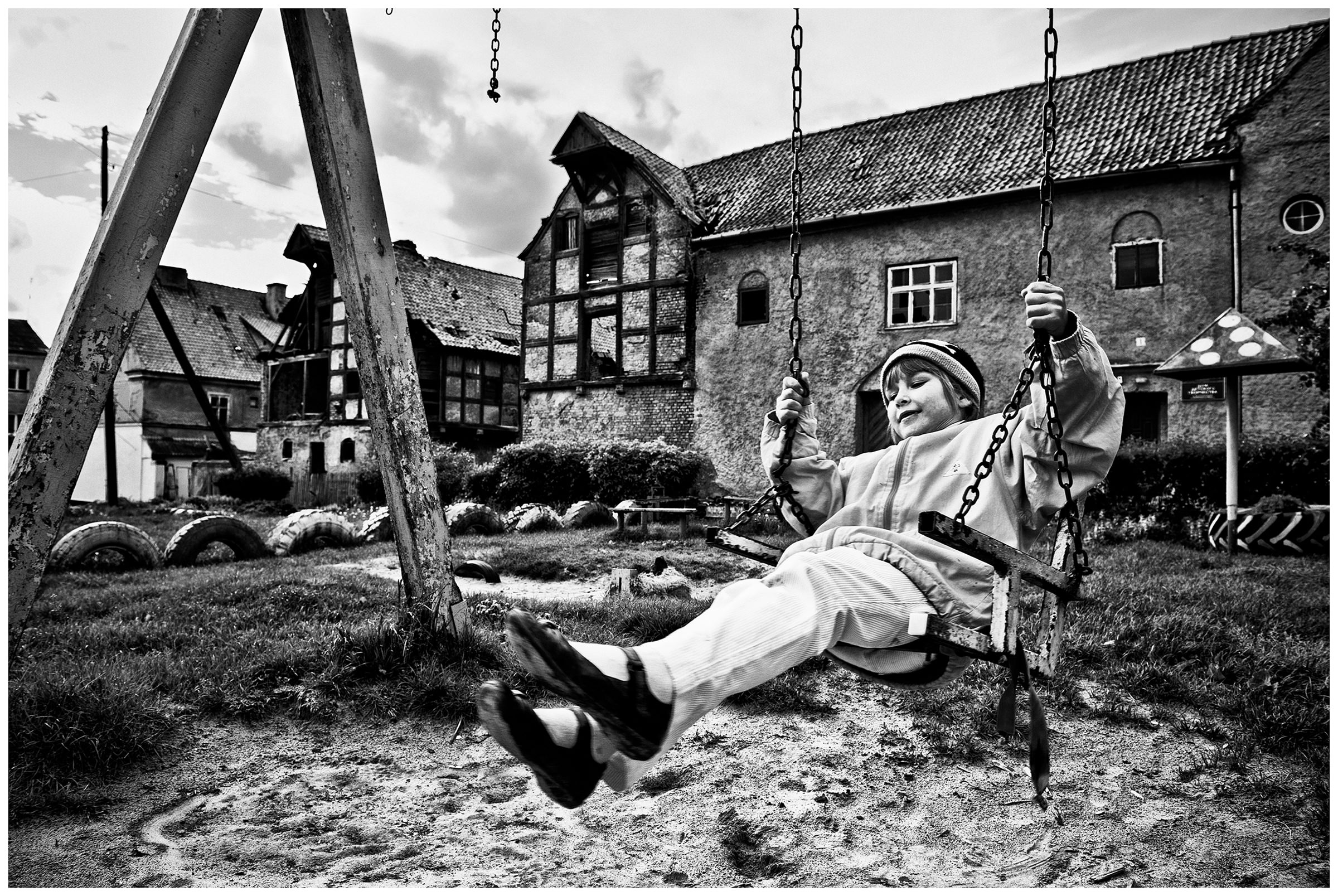 Kaliningrad, Russia. A girl swings on a swing in Zheleznodoroshny.