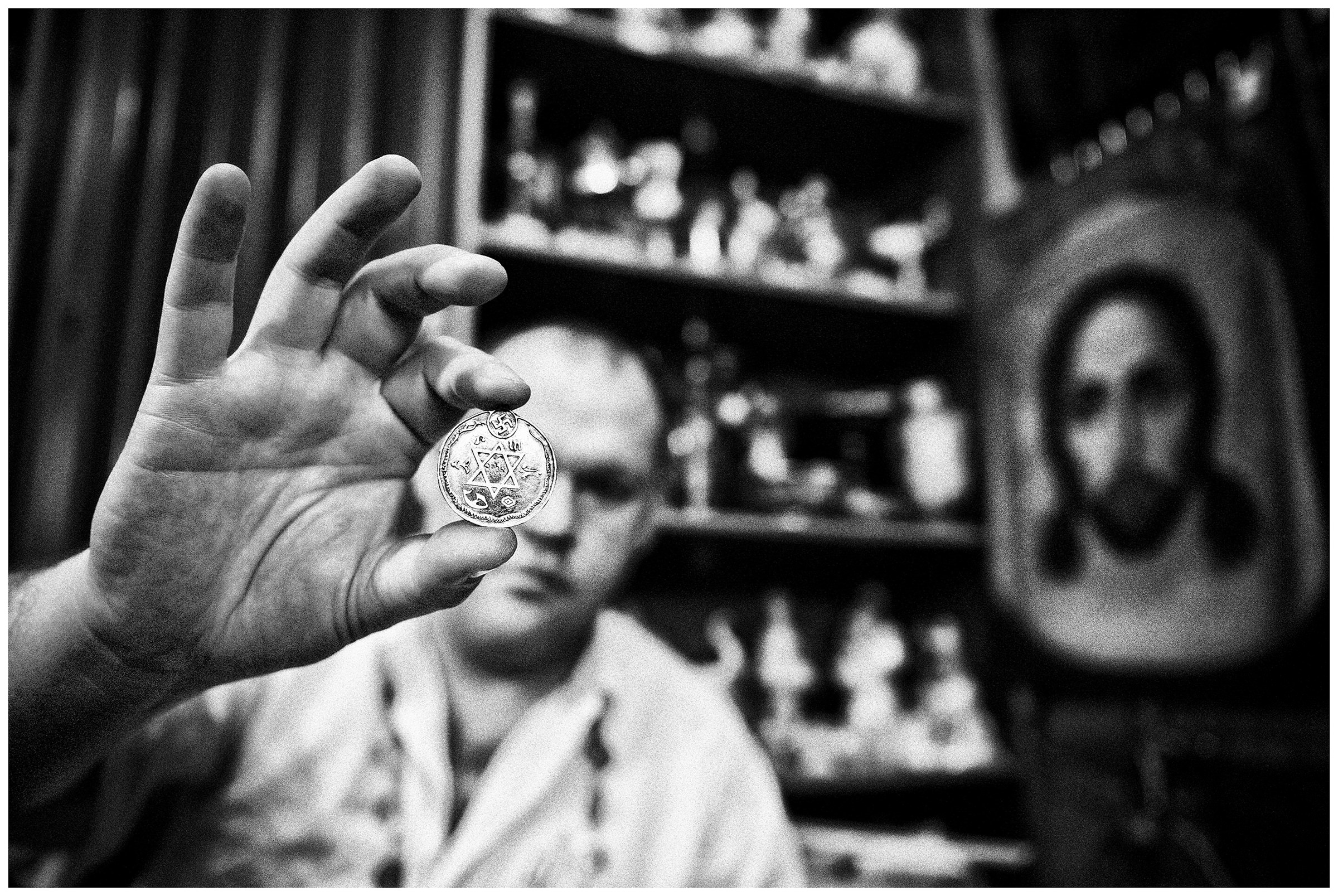 Kaliningrad, Russia. An antiquarian shows a medallion.
