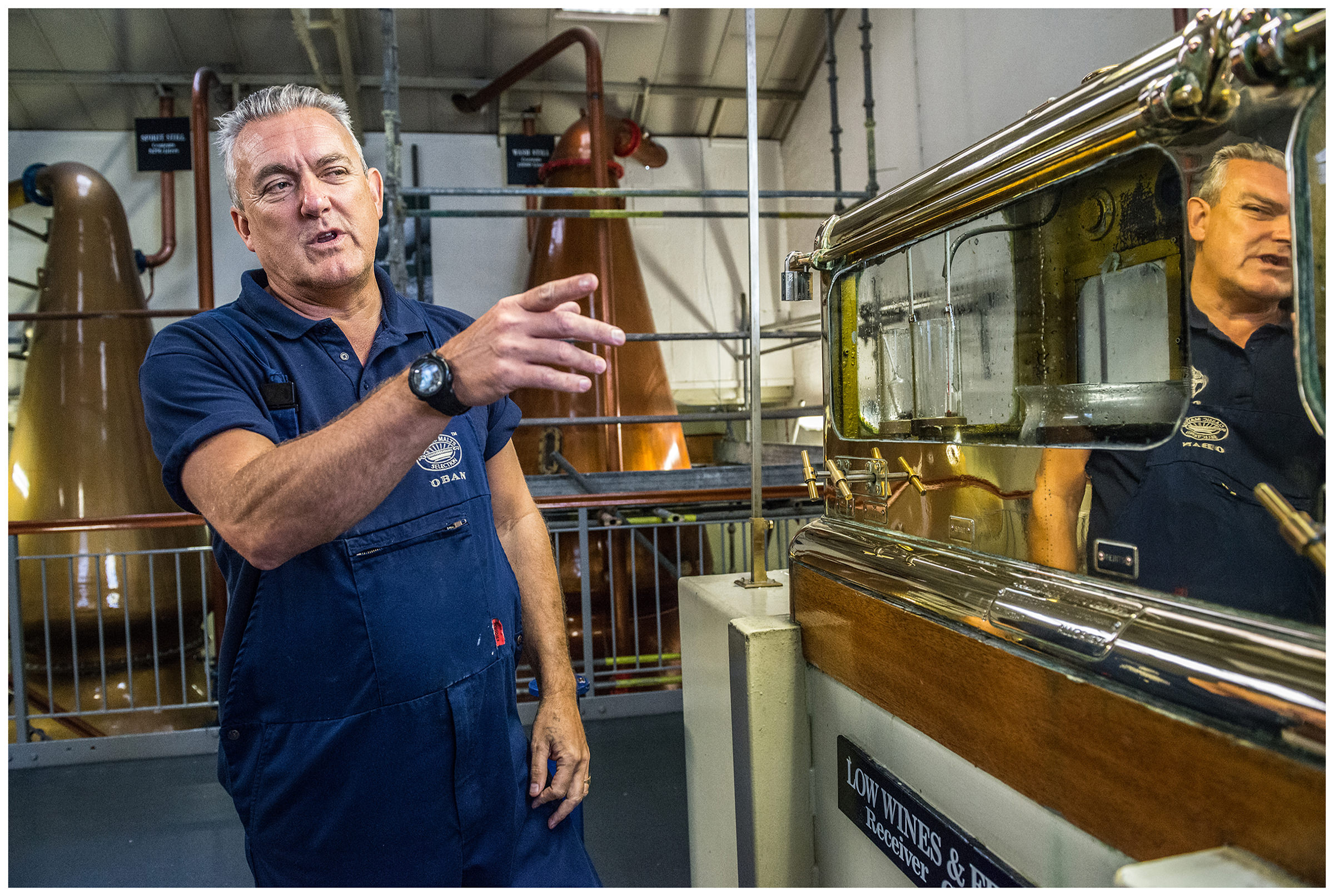 Scotland, Oban. Paul Cummias has worked at the Oban Distillery for 27 years. In the picture he checks the alcohol content of the distillate for wiskey.