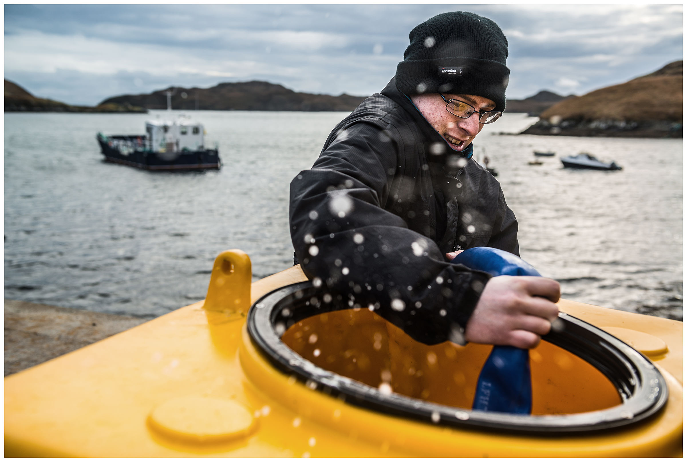 Scotland, Isle of Lewis A young man fills a tank with seawater. The company "Hebridean Sea Salt" extracts table salt from the sea water.