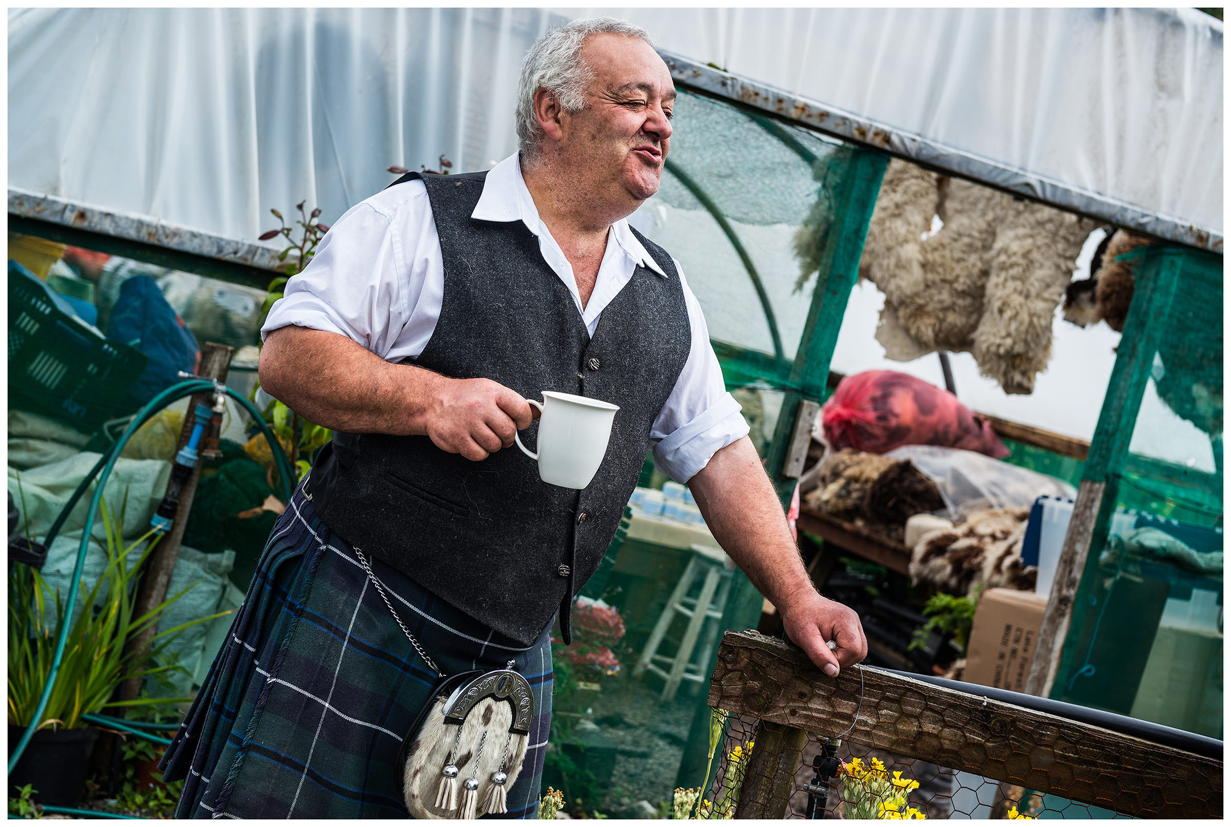Scotland, Benderloch A seller drinks tea at the wool festival in Benderloch.