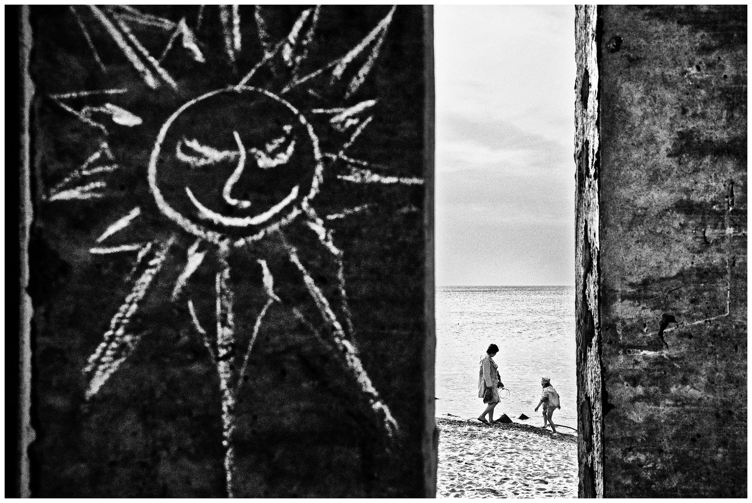 Kaliningrad, Russia. A woman walks with a child along the coast in Zelenogradsk.