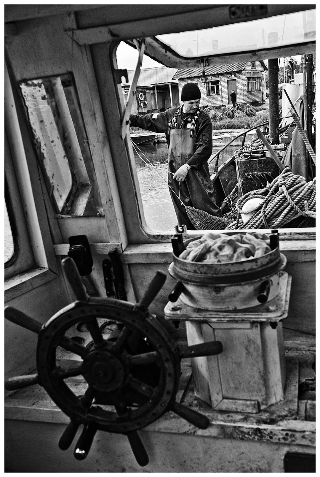 Kaliningrad, Russia. A fisherman finishes the nets.