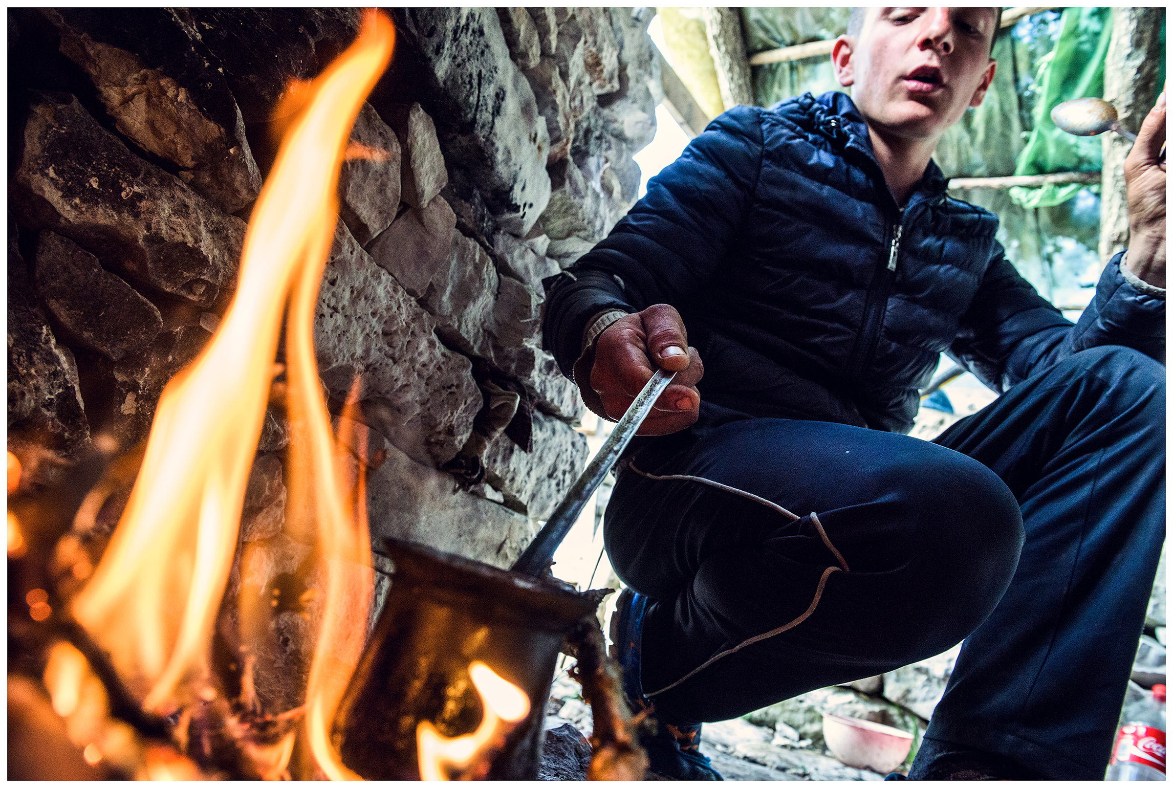 Albania, Llogora National Park. A shepherd cooks coffee in his mountain hut on a mountain pasture.