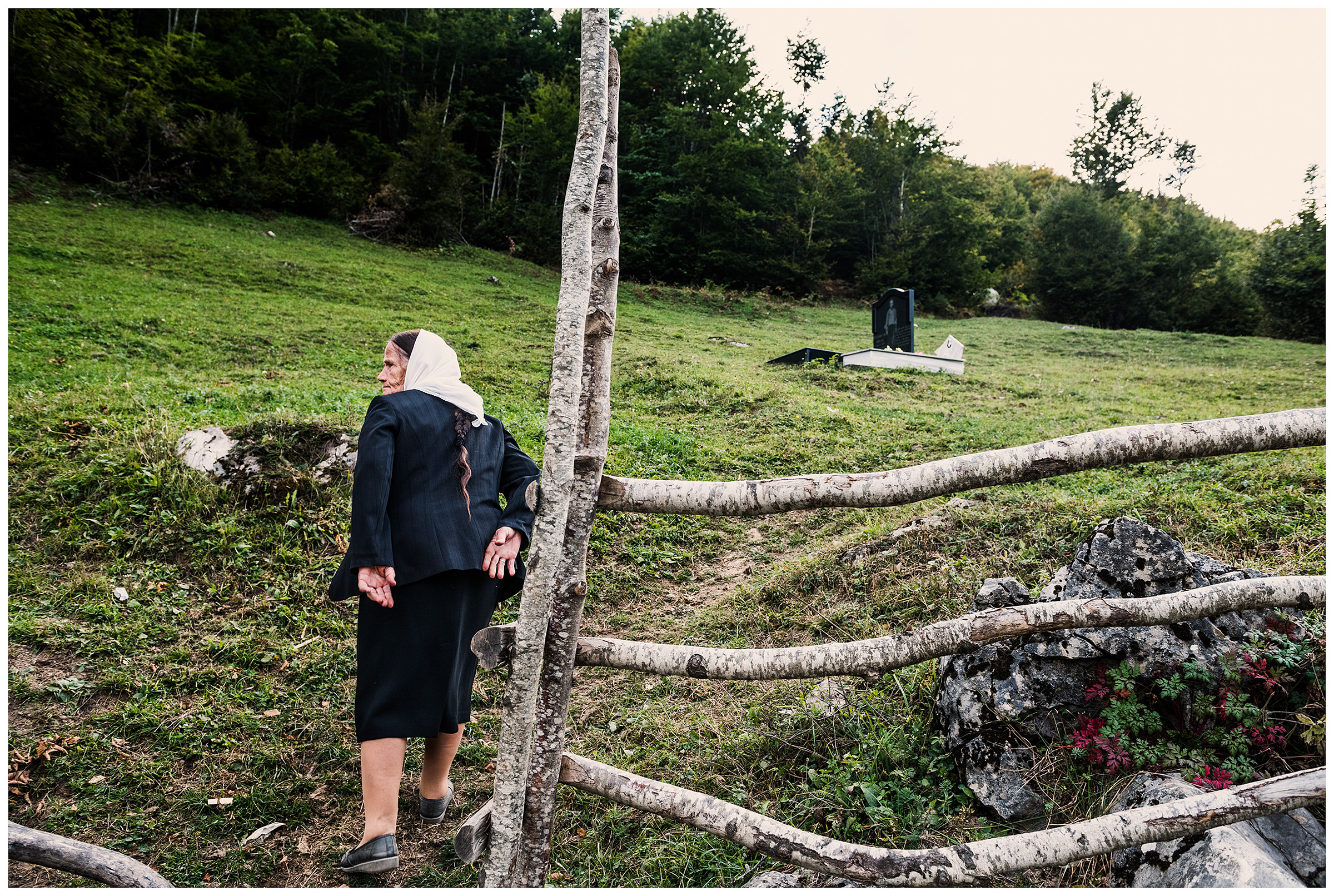 Cerem, Albania. An old woman goes to her husband's grave in the mountains. The man is a victim of the Hoxha regime.