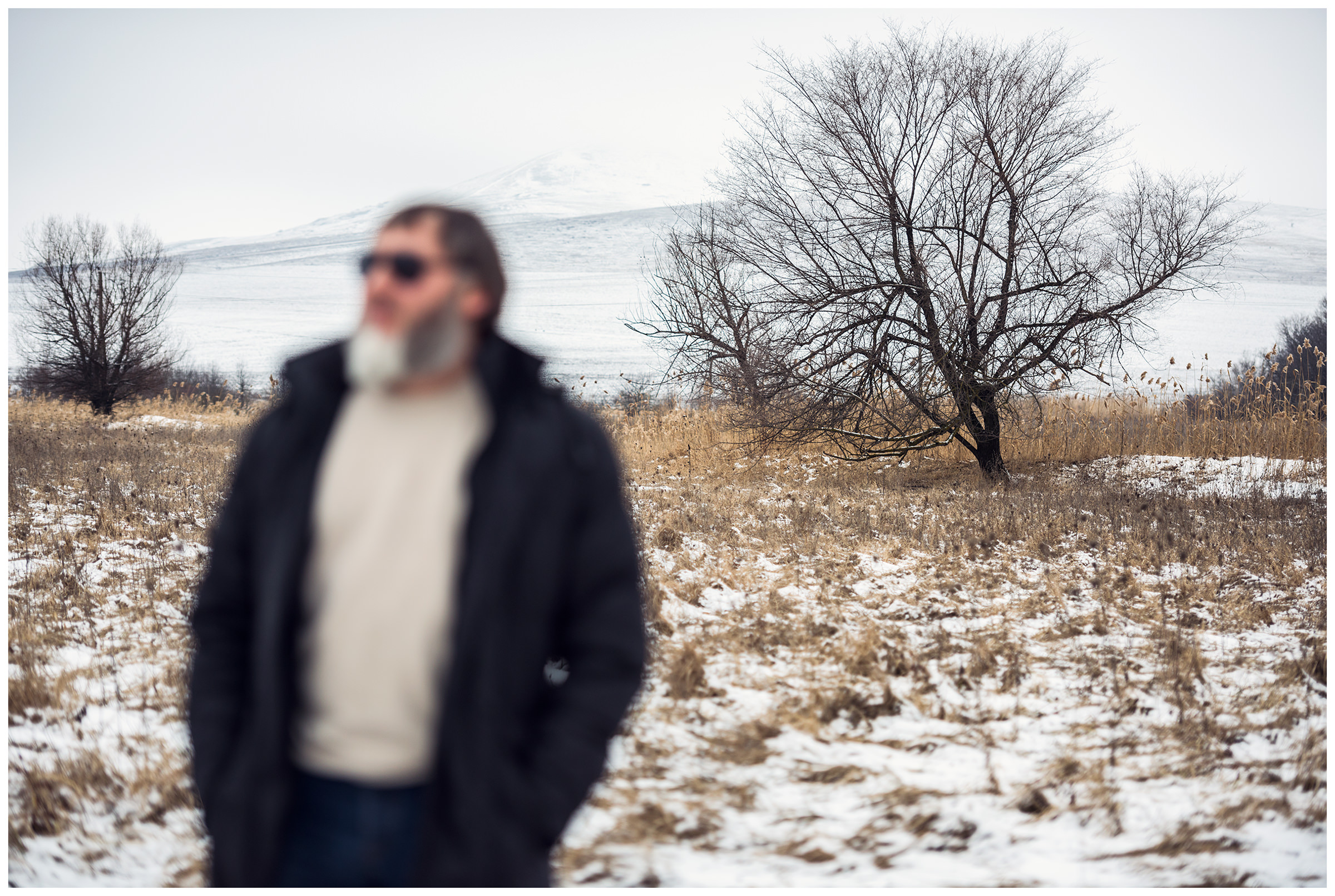 Kabardino-Balkaria, Russia. A Chechen man is standing on the field.