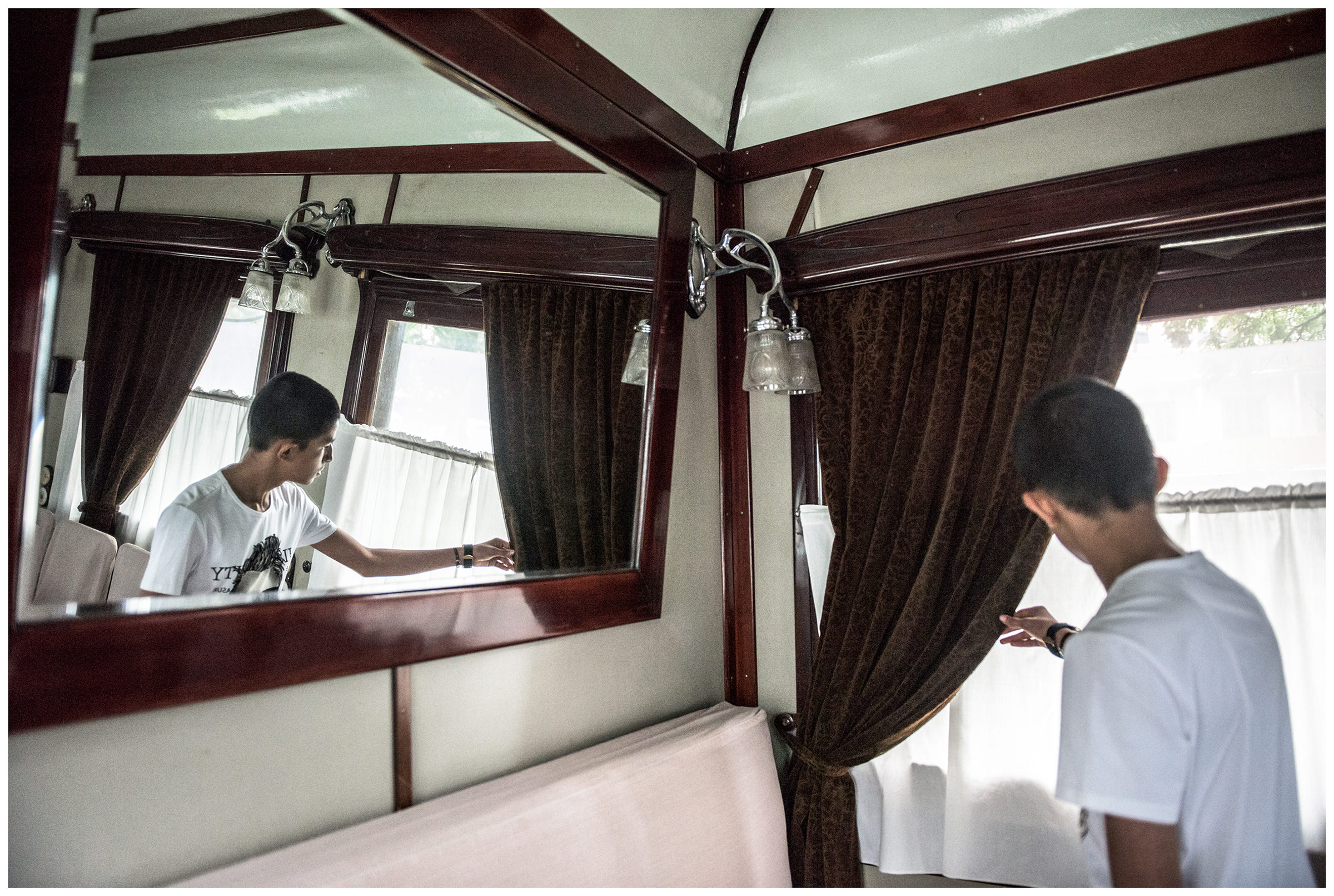A tourist takes a look at the personal wagon of Stalin, which stands next to the Stalin Museum.