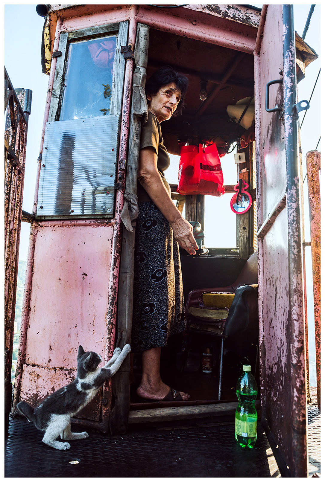 Chiatura, Imeretia, Georgia. A cable car helmswoman is standing at her workplace. She has been working here for 33 years.