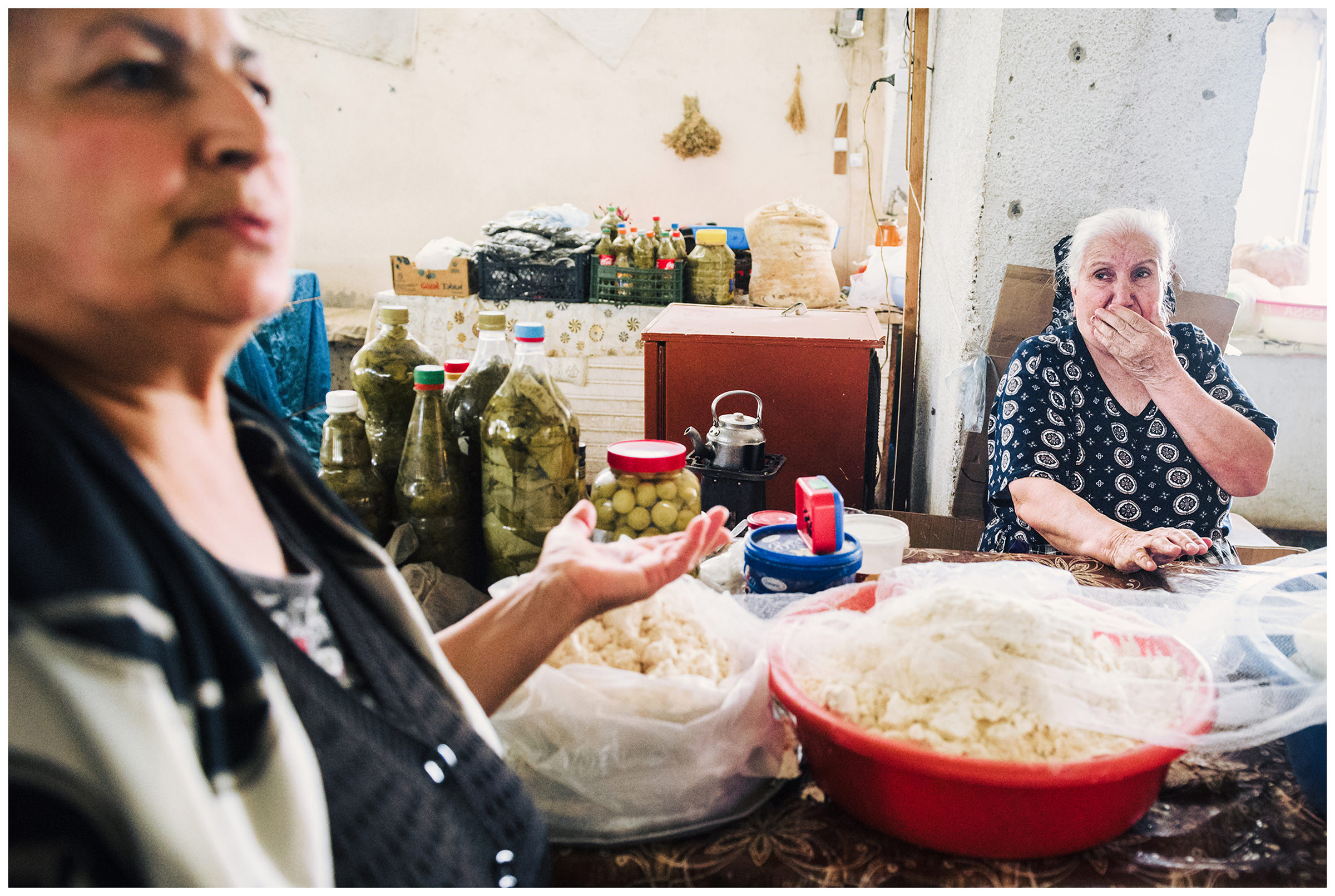Azerbaijan, Barda. Two women sell cheese at the market in the town of Barda.