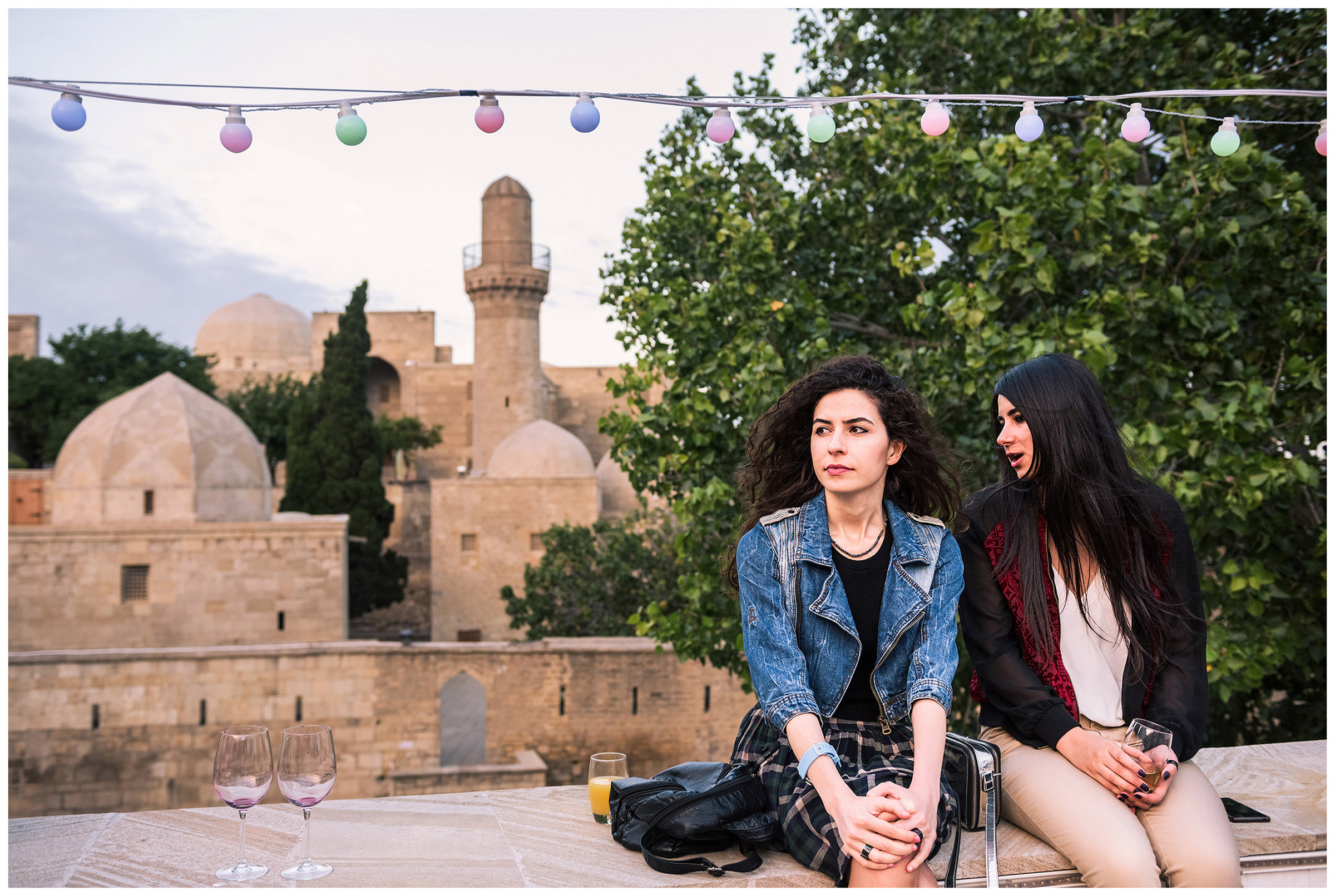 Azerbaijan, Baku. Two young women sit on the balcony of the Gallery of Modern Art.