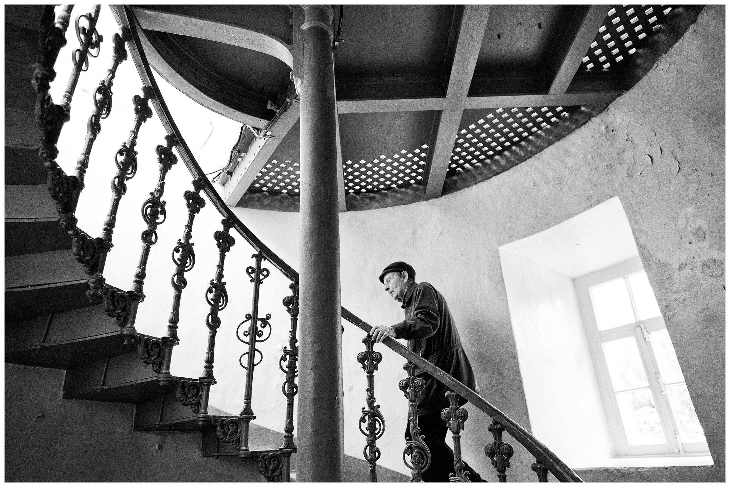 Cape Ay-Todor, the Crimea. A lighthouse keeper climbs the stairs of the lighthouse at Cape Ay-Todor.