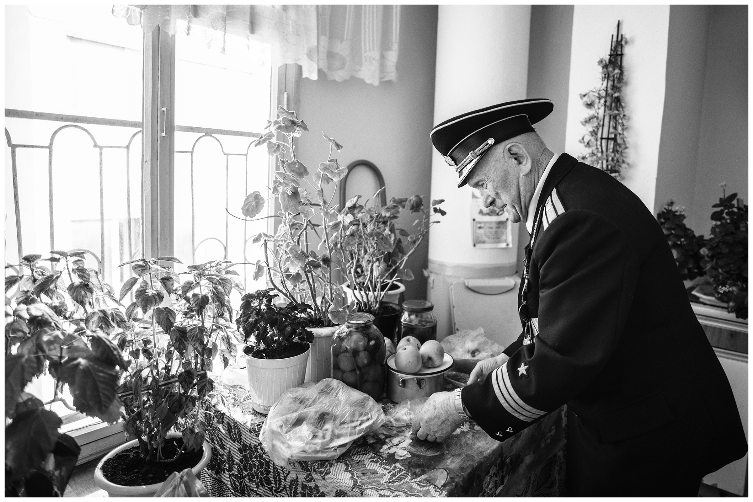 Sevastopol, the Crimea. The former submarine captain of third rank stands in his apartment and sorts out food.
