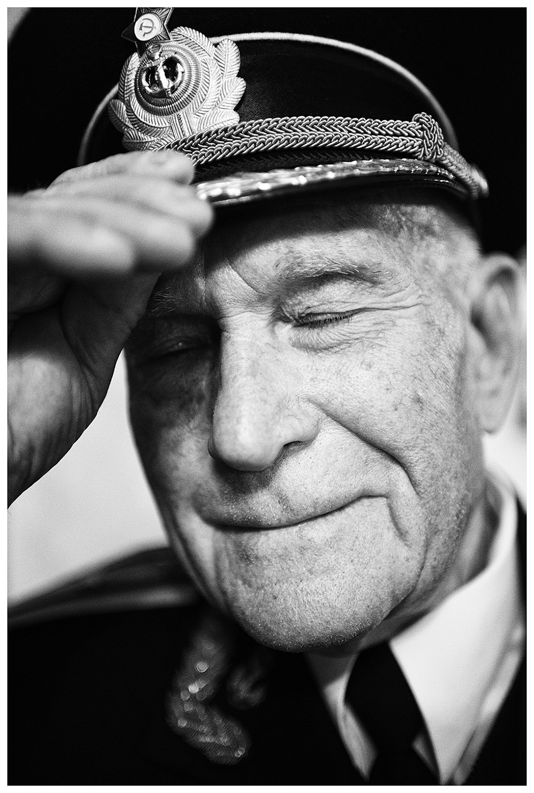 Sevastopol, the Crimea. The former third-ranking submarine captain is standing in his apartment.