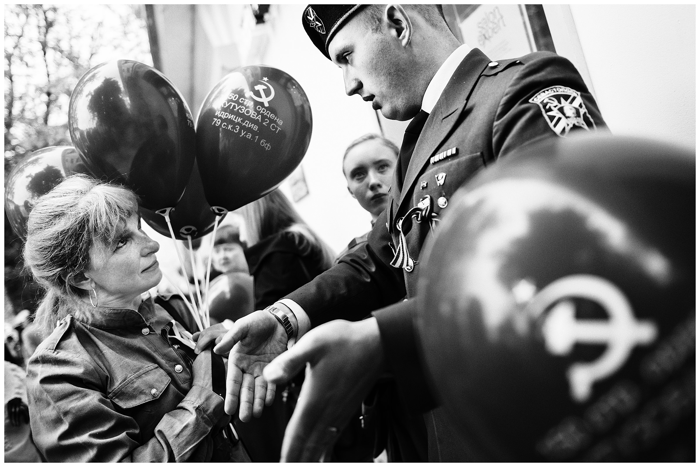 Sevastopol, the Crimea. The participants of the military parade are talking on the roadside. The military parade is taking place on the occasion of the victory over Nazi Germany on May 9.