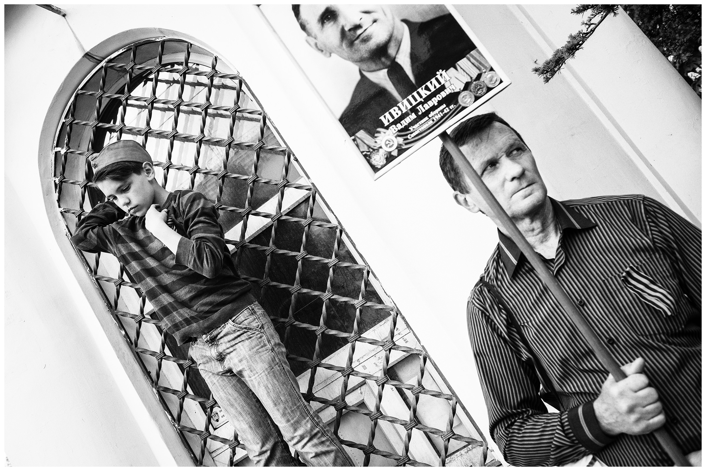 Sevastopol, the Crimea. A demonstrator of the so-called "Immortal Regiment" takes part in the military parade with a portrait of his ancestor. The military parade takes place on the occasion of the victory over Nazi Germany on May 9.