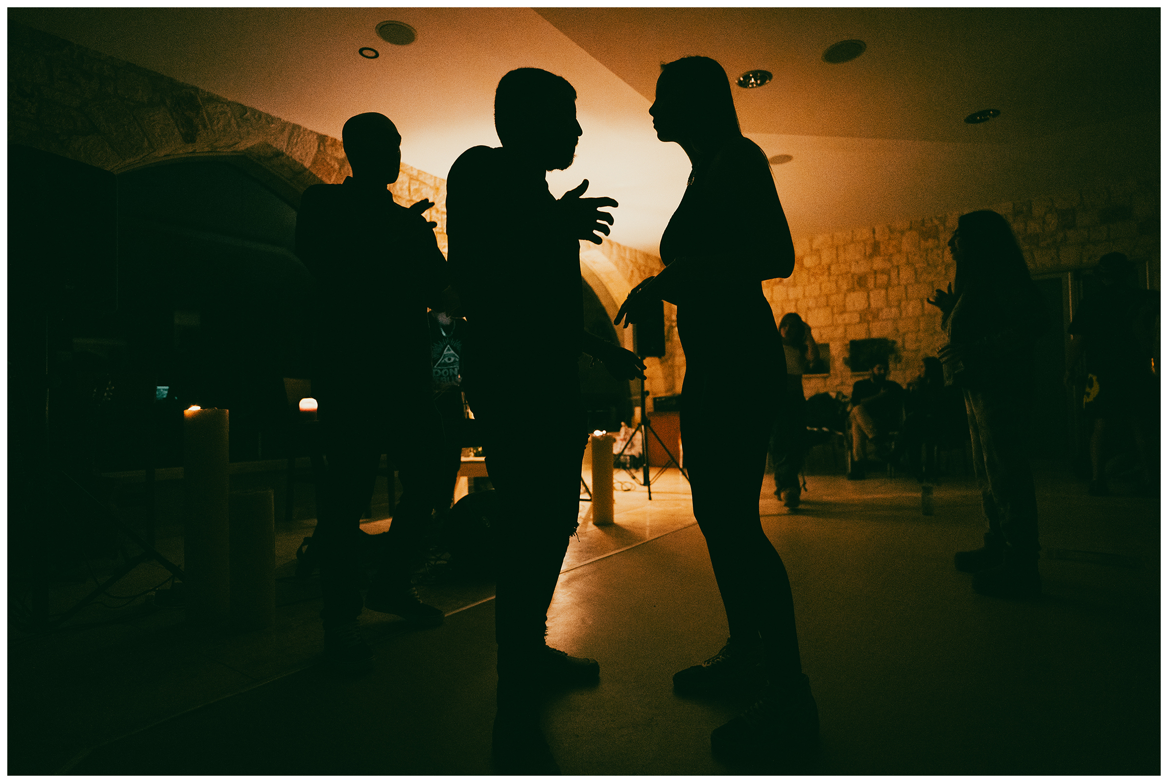 Miliou, Cyprus. Silhouettes of young Israelis dancing late in the evening at the Secret Forest wellness retreat.